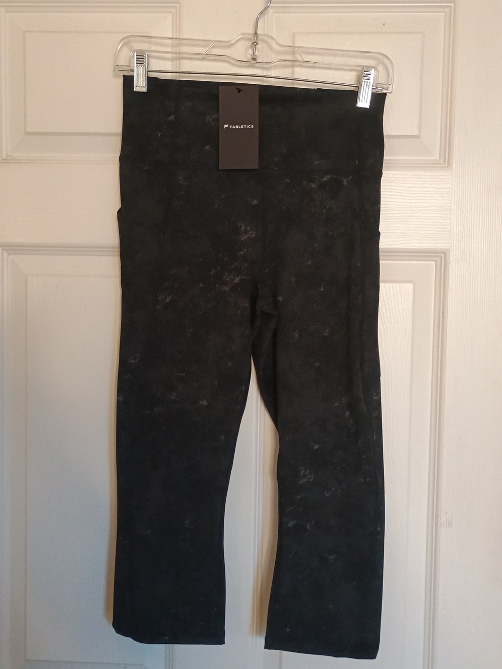 Fabletics Oasis High Waisted Black Flared Capri Leggings with Subtle Marble Wash